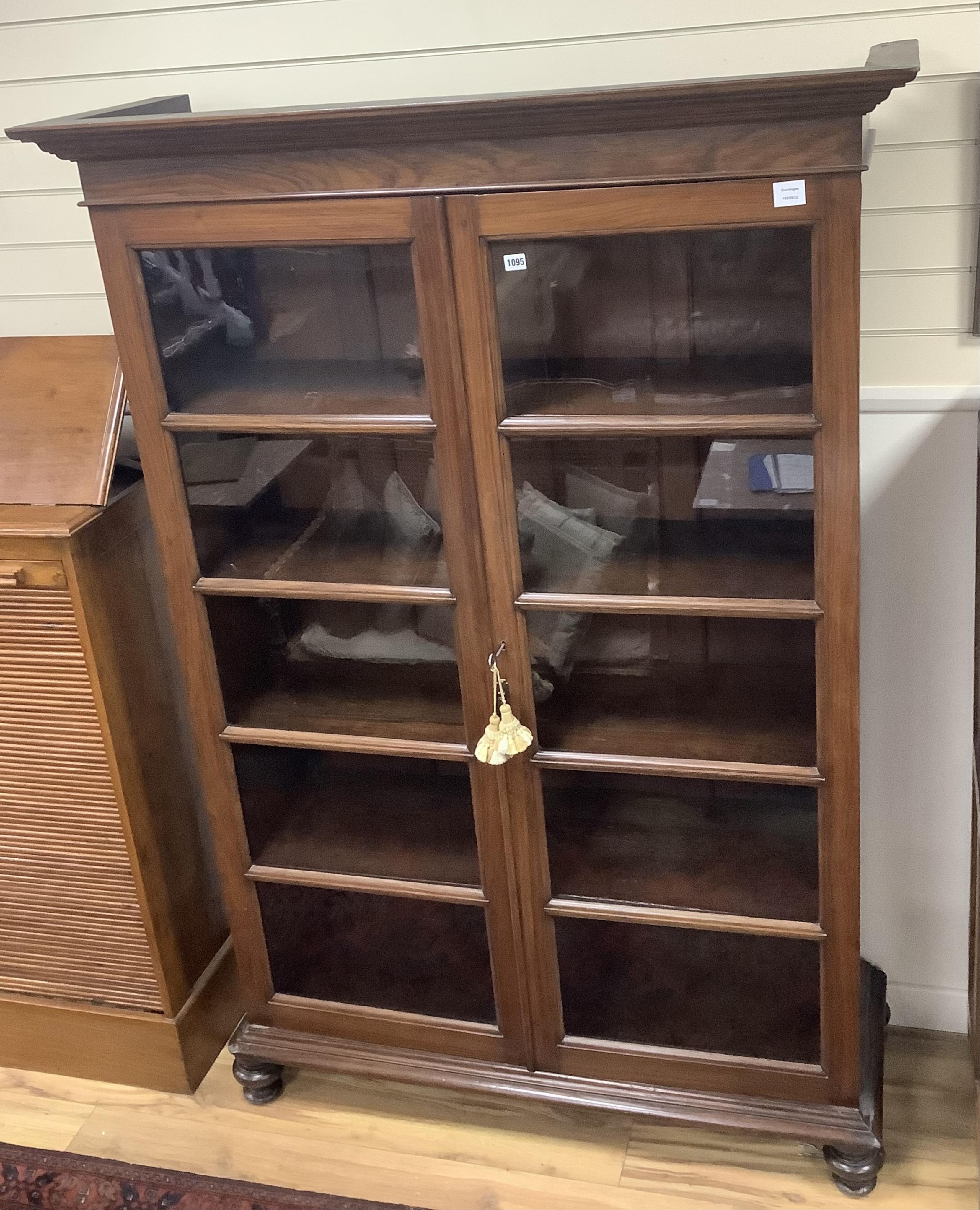 A 20th century Victorian style Anglo Indian rosewood bookcase, width 127cm, depth 44cm, height 186cm. Condition - good